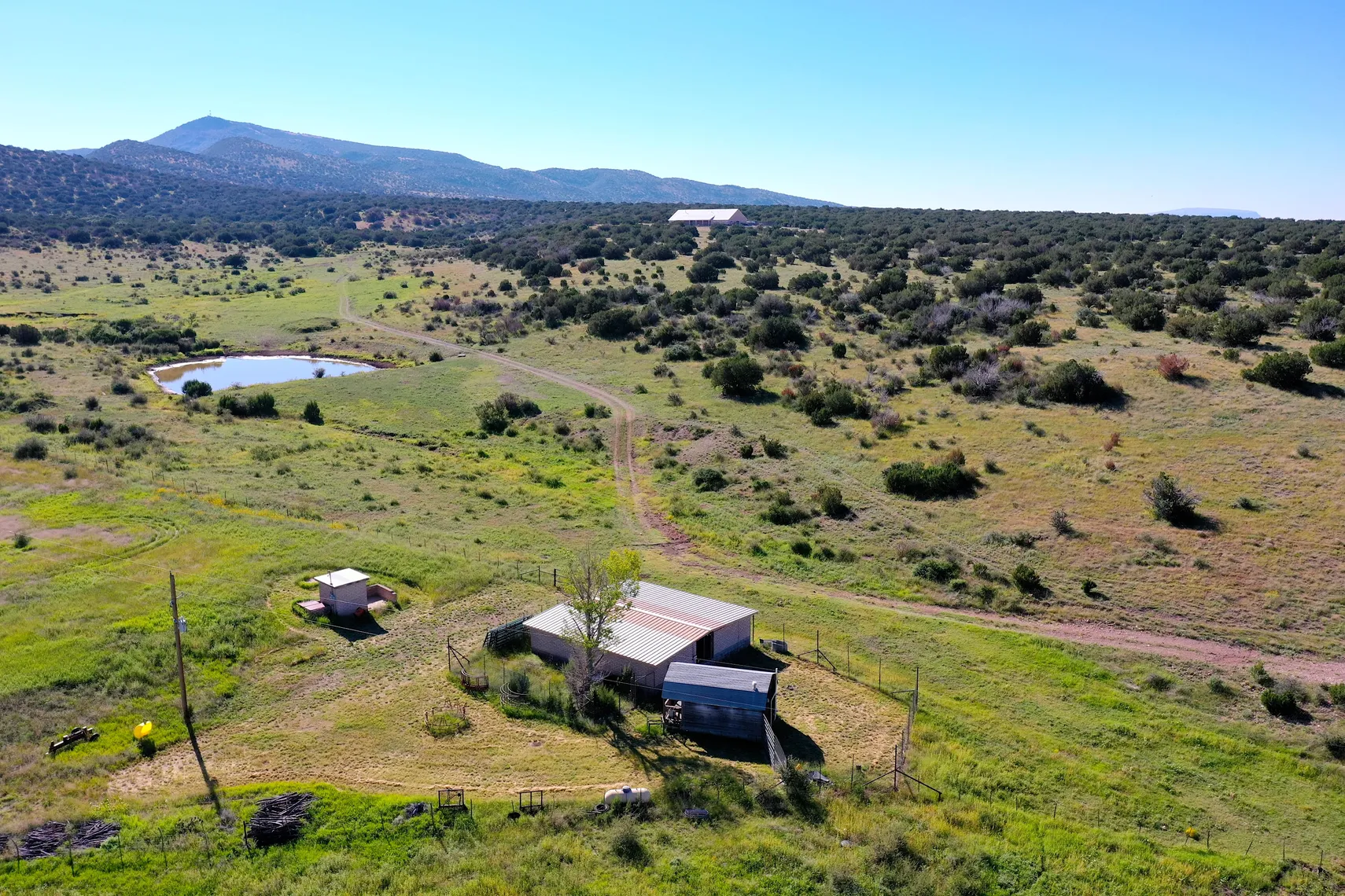Aerial of the stock pond, outbuilding, and former kennel