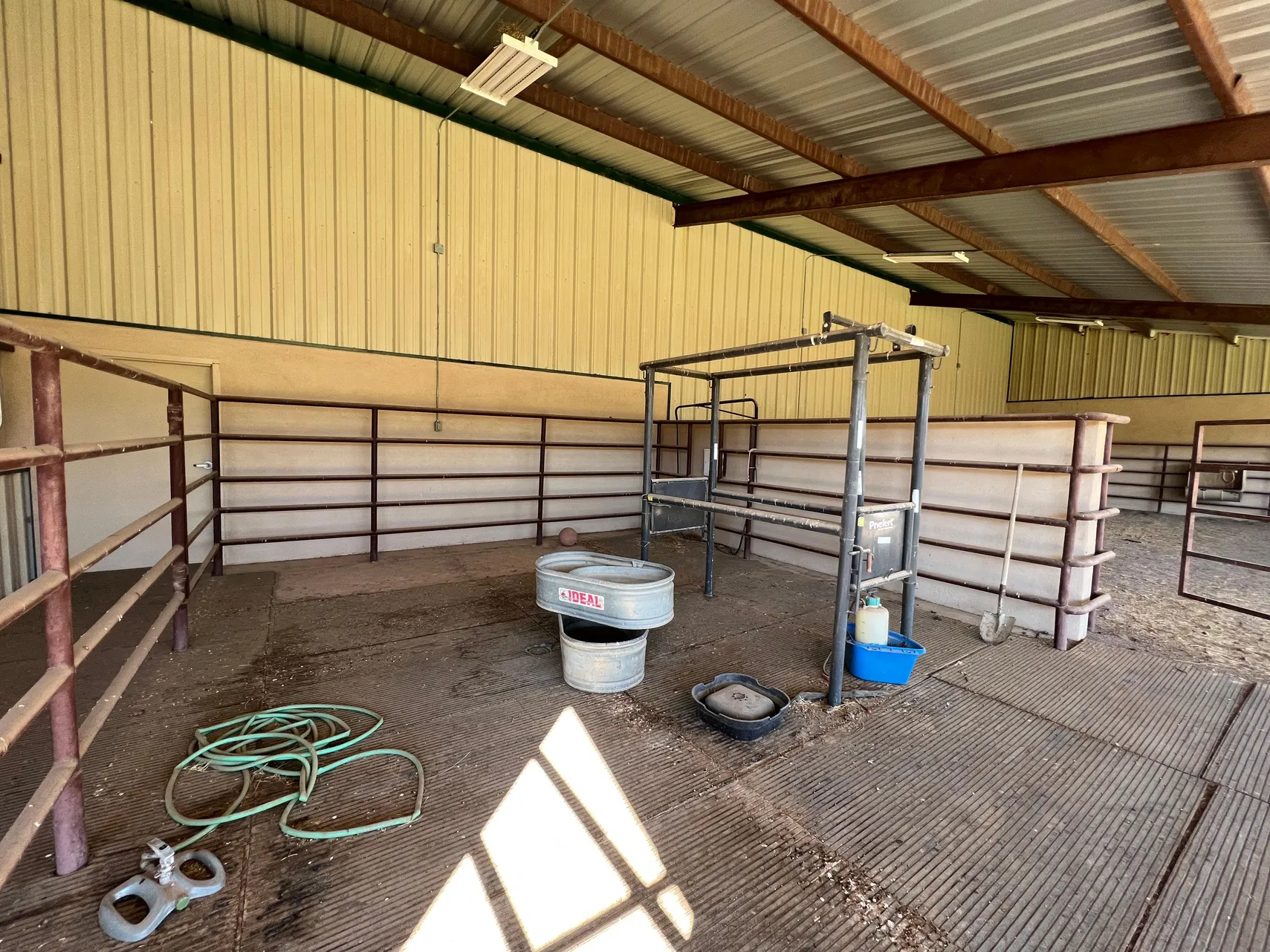 Covered outdoor stall with automatic waterer and rubber mats