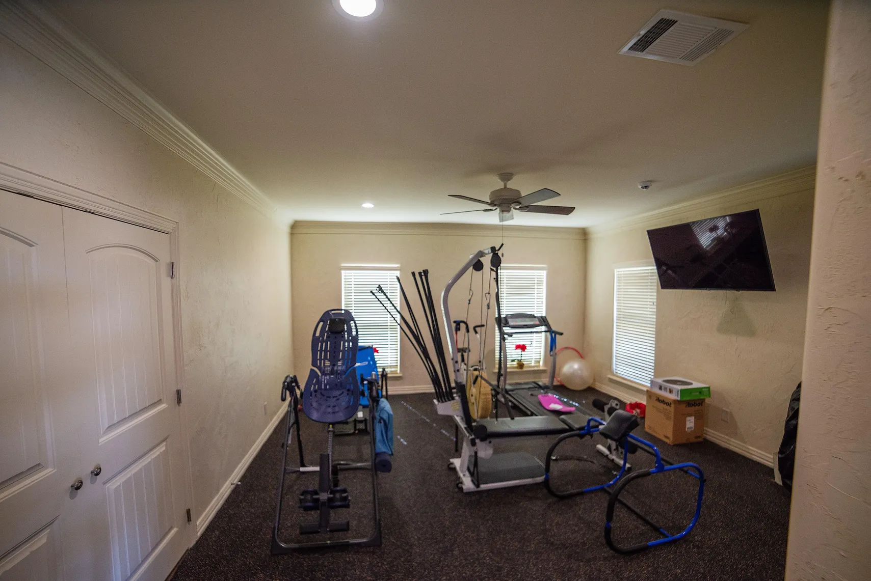 Guest room currently used as a fitness room